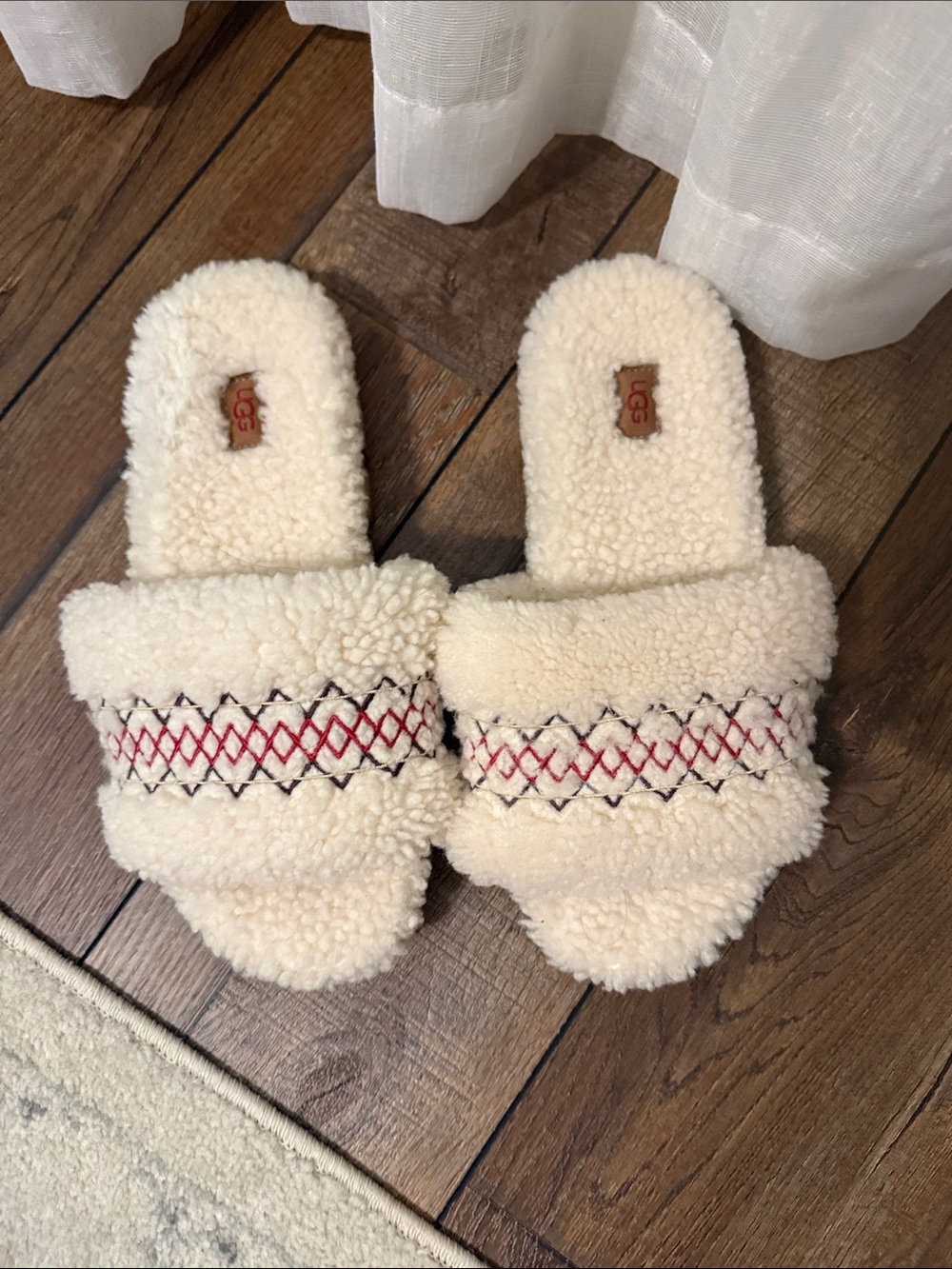 UGG Cream Shearling Slide Slippers with Red and Black Stitching